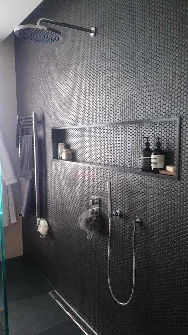 Superb modern male shower with black hexagonal mosaic covering.  The wall niche is very useful and functional.