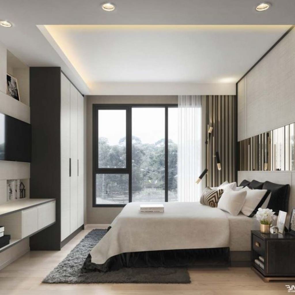 Superb modern bedroom in black and white with some golden details.  The windows provide the right natural light, while for the evening lighting a cut of the plasterboard false ceiling was created in which the LED lights were inserted