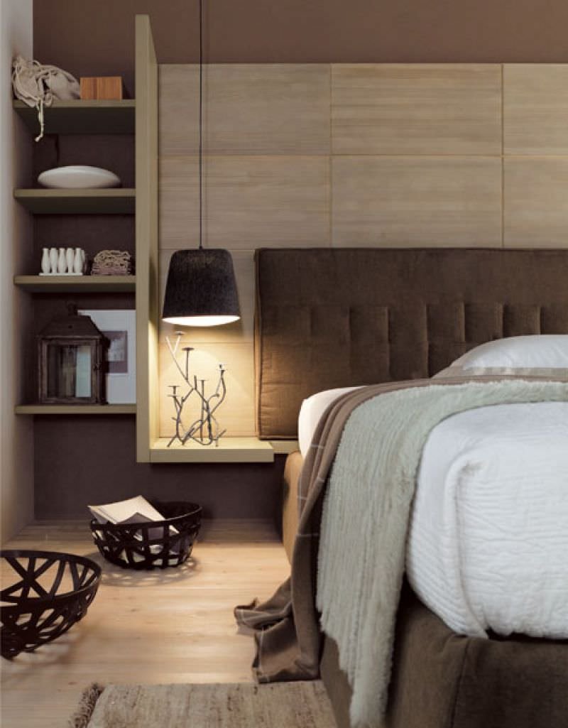 Double room with elegant and functional and comfortable headboard.  In this example the padding and upholstery are in cotton and suggest great comfort.  Earth colors, various shades of brown - dark wood floor.  Modern style