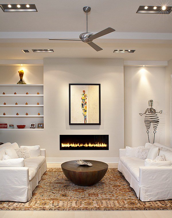 The unusual coffee table makes a good pair with the elegant fireplace