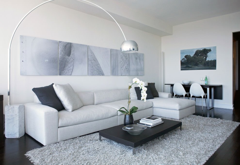 Soggiorno contemporaneo di ispirazione scandinava in colori neutri: bianco, nero e grigio